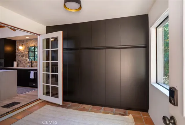 a kitchen with a sink appliances and cabinets