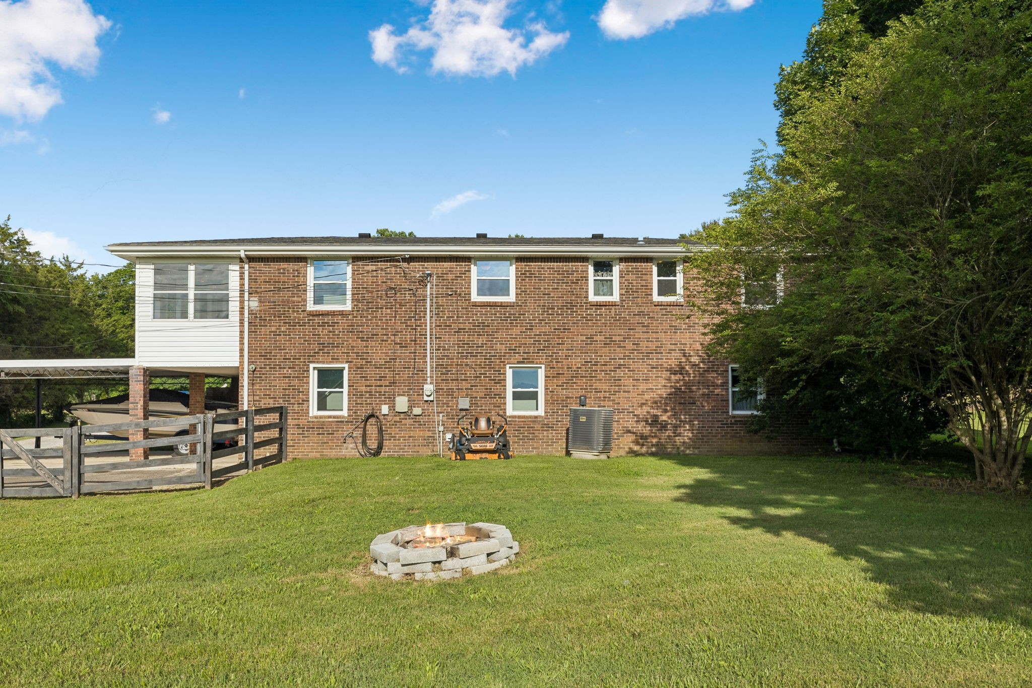 1326 Shahan Road Pleasant View, TN 37146 - Photo 36 of 41 a front view of a house with a yard fire pit and outdoor seating