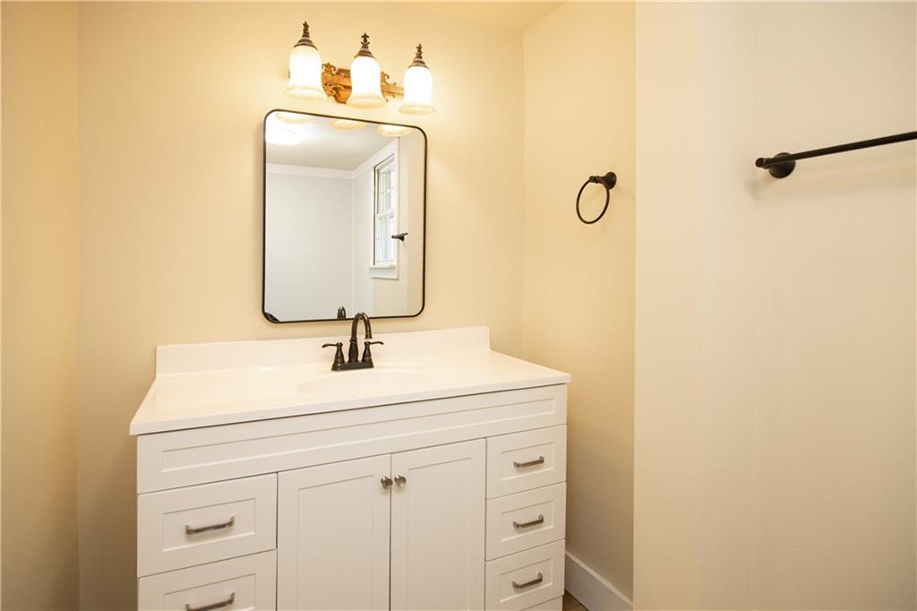 163 Rabbit Town Road Tate, GA 30177 - Photo 24 of 32 a bathroom with a sink and a mirror