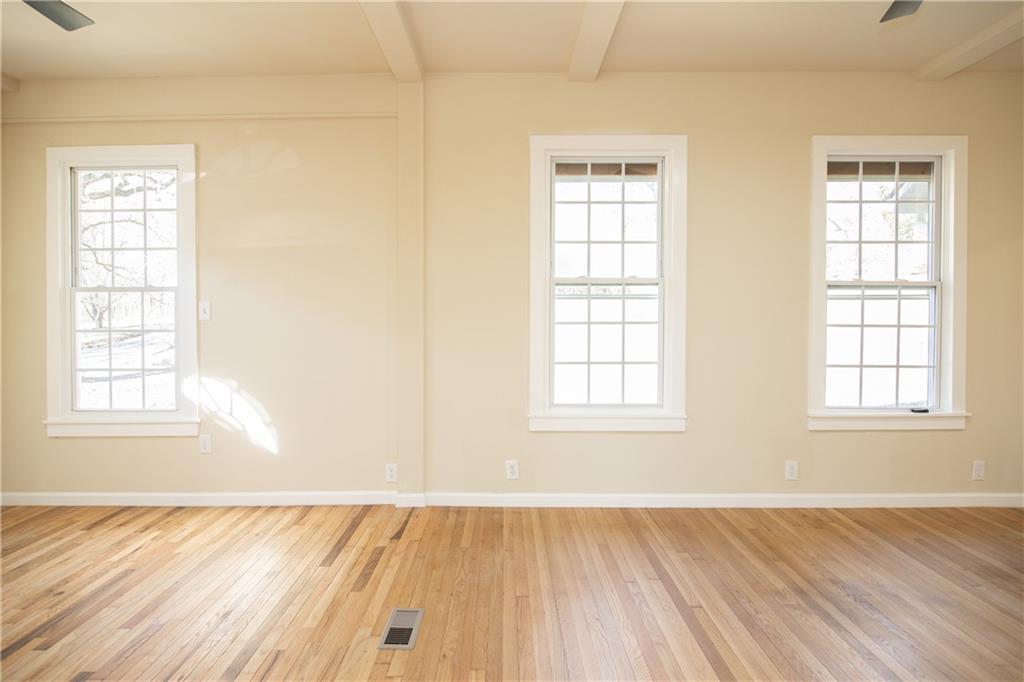 163 Rabbit Town Road Tate, GA 30177 - Photo 9 of 32 an empty room with wooden floor and windows