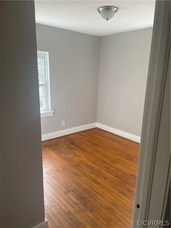 2400 Coxendale Road Chester, VA 23831 - Photo 5 of 5 an empty room with wooden floor and windows