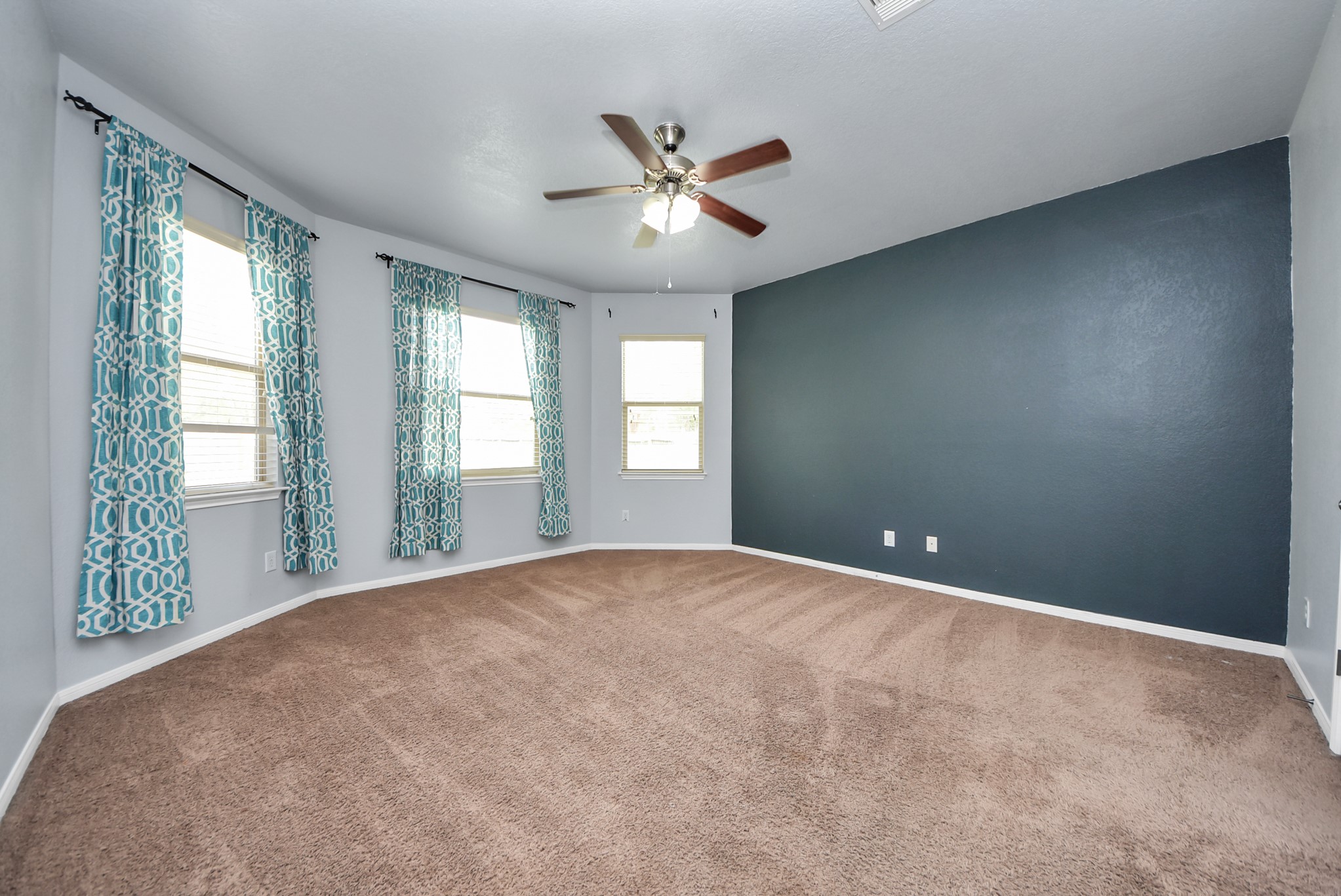 33227 Greenfield Forest Drive Spring, TX 77382 - Photo 11 of 50 a view of an empty room with window and chandelier fan