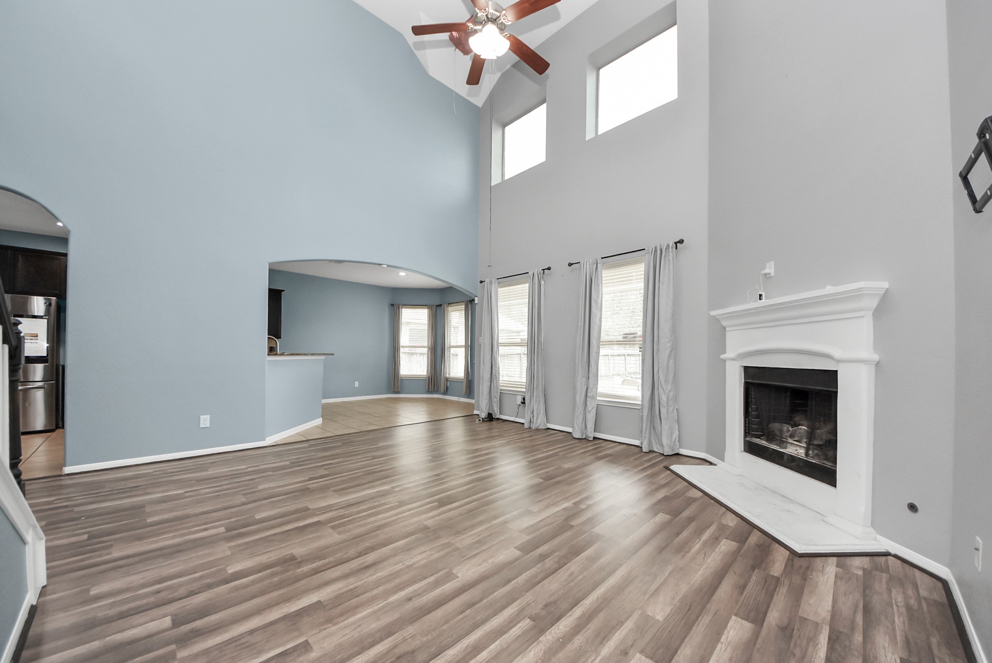 33227 Greenfield Forest Drive Spring, TX 77382 - Photo 21 of 50 a view of an empty room with wooden floor fireplace and a window