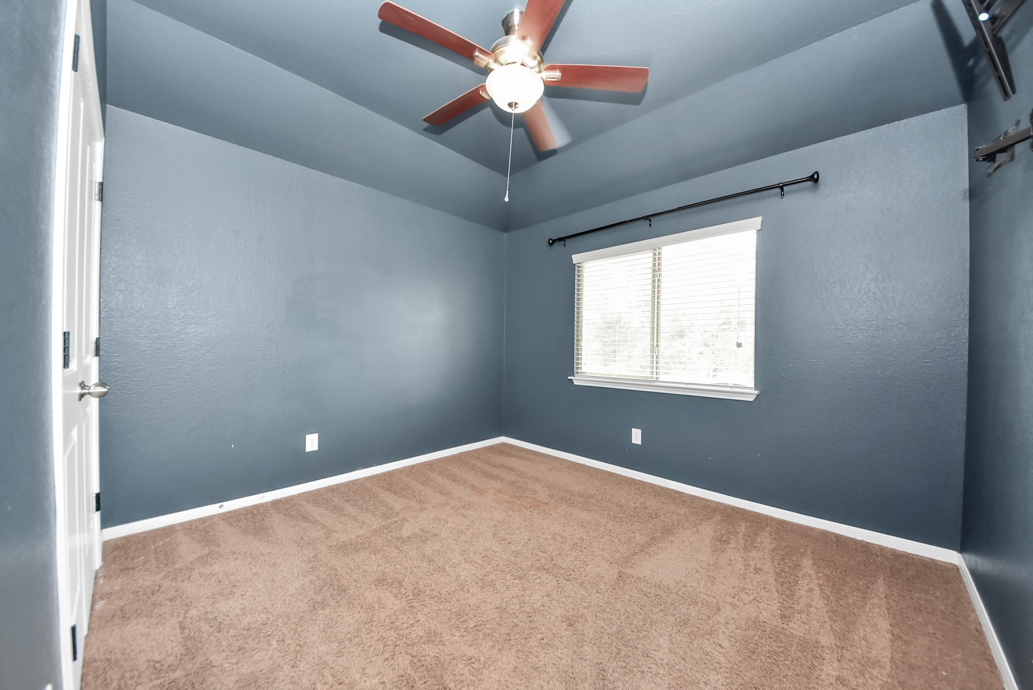 33227 Greenfield Forest Drive Spring, TX 77382 - Photo 39 of 50 a view of a room with a ceiling fan and a window