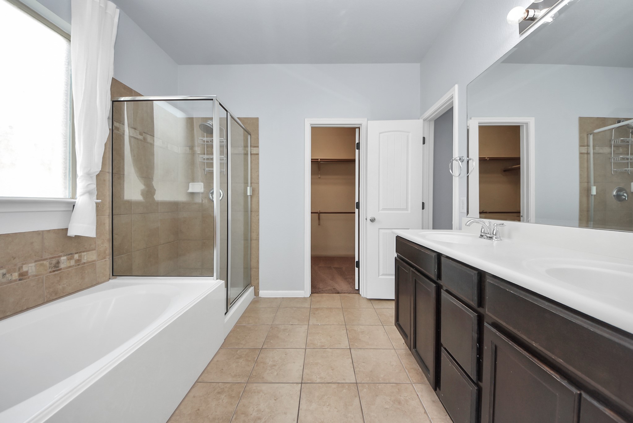 33227 Greenfield Forest Drive Spring, TX 77382 - Photo 43 of 50 a spacious bathroom with a bathtub and a sink