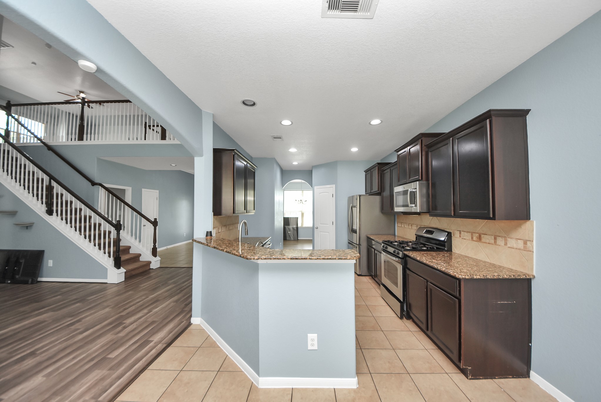 33227 Greenfield Forest Drive Spring, TX 77382 - Photo 50 of 50 a kitchen with stainless steel appliances granite countertop a sink stove and cabinets