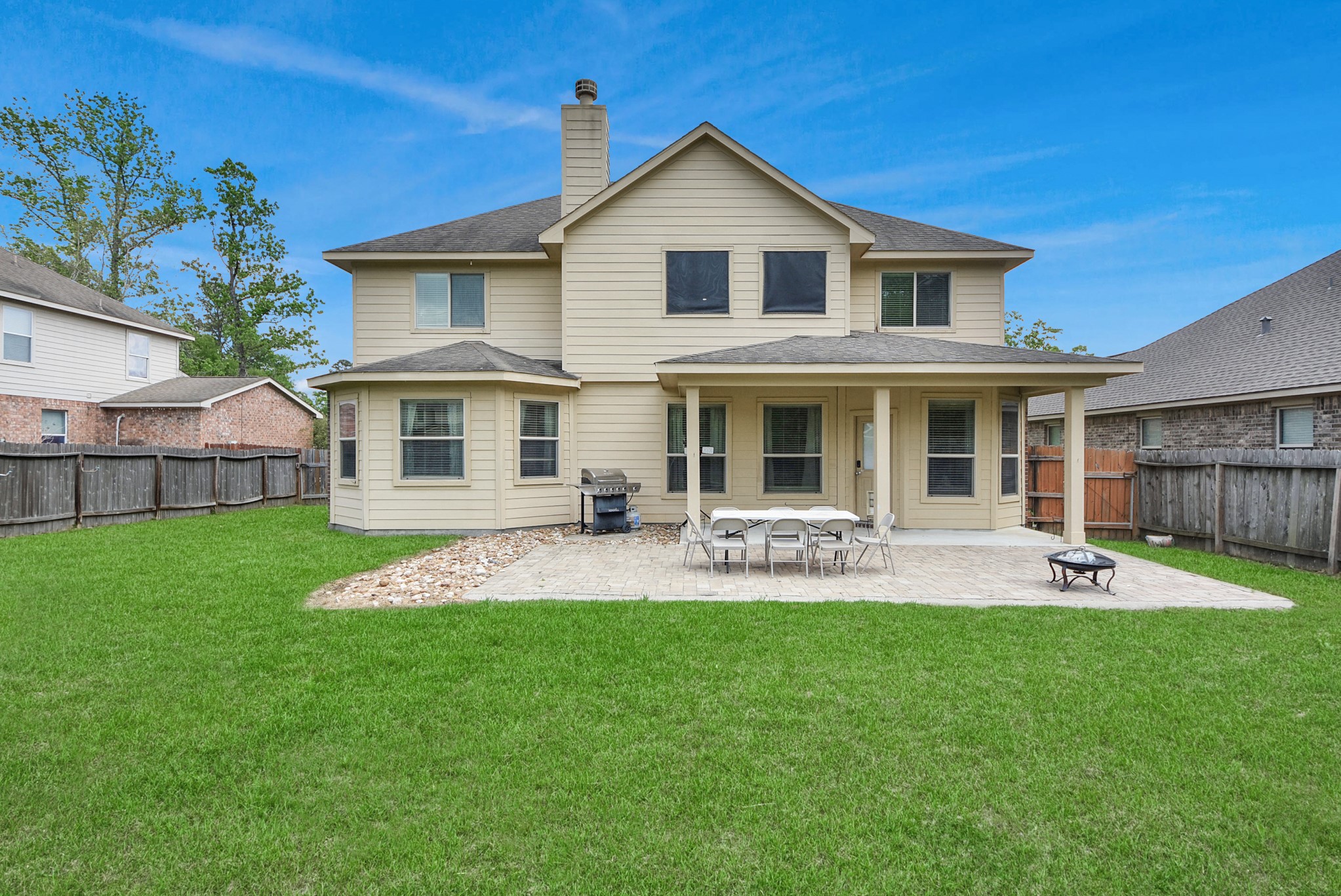 33227 Greenfield Forest Drive Spring, TX 77382 - Photo 8 of 50 a front view of a house with a yard and patio