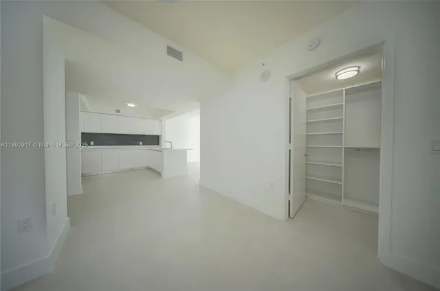 a view of an empty walk in closet