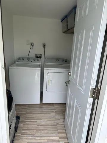 a view of storage and utility room with washer and dryer