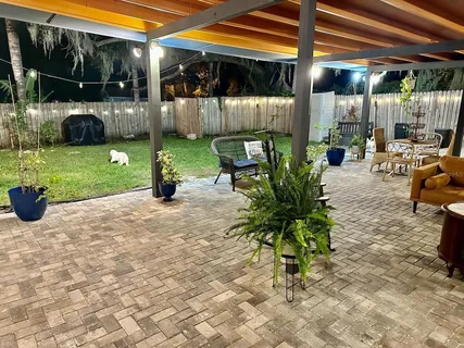 a view of a porch with dining area