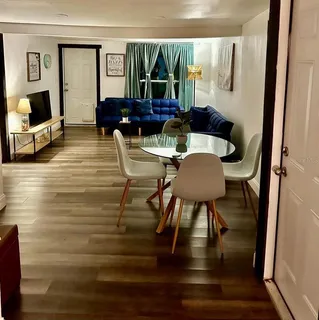 a living room with furniture and a flat screen tv