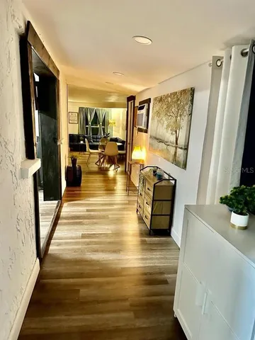 a view of living room with furniture and flat screen tv