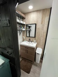 a bathroom with a sink and a mirror