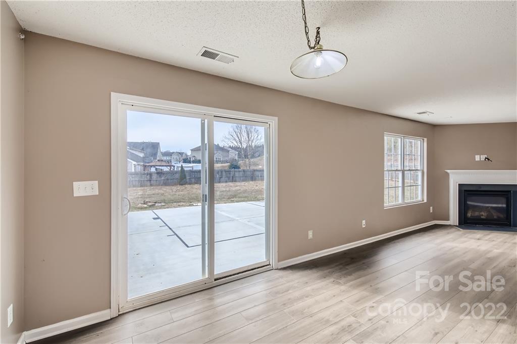 7005 Copper Ridge Court Gastonia, NC 28056 - Photo 14 of 33 a view of livingroom with furniture wooden floor and window
