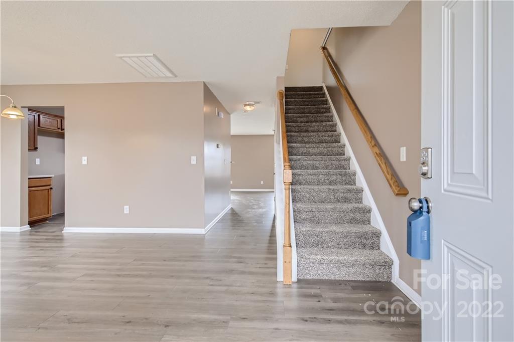 7005 Copper Ridge Court Gastonia, NC 28056 - Photo 2 of 33 a view of an entryway with wooden floor