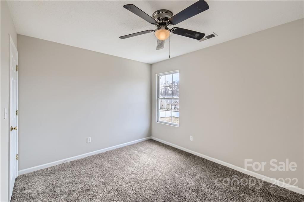 7005 Copper Ridge Court Gastonia, NC 28056 - Photo 23 of 33 a view of an empty room with a window