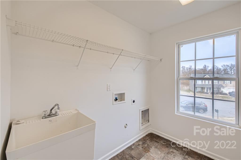 7005 Copper Ridge Court Gastonia, NC 28056 - Photo 27 of 33 a bathroom with a sink and a window