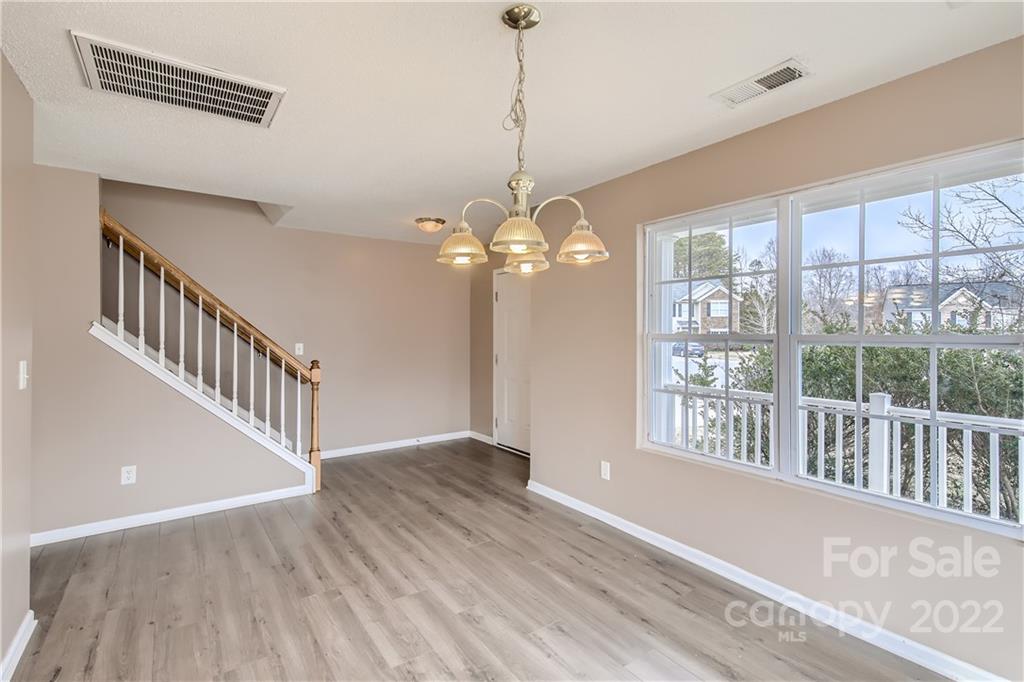 7005 Copper Ridge Court Gastonia, NC 28056 - Photo 9 of 33 a view of a room with wooden floor fan and windows