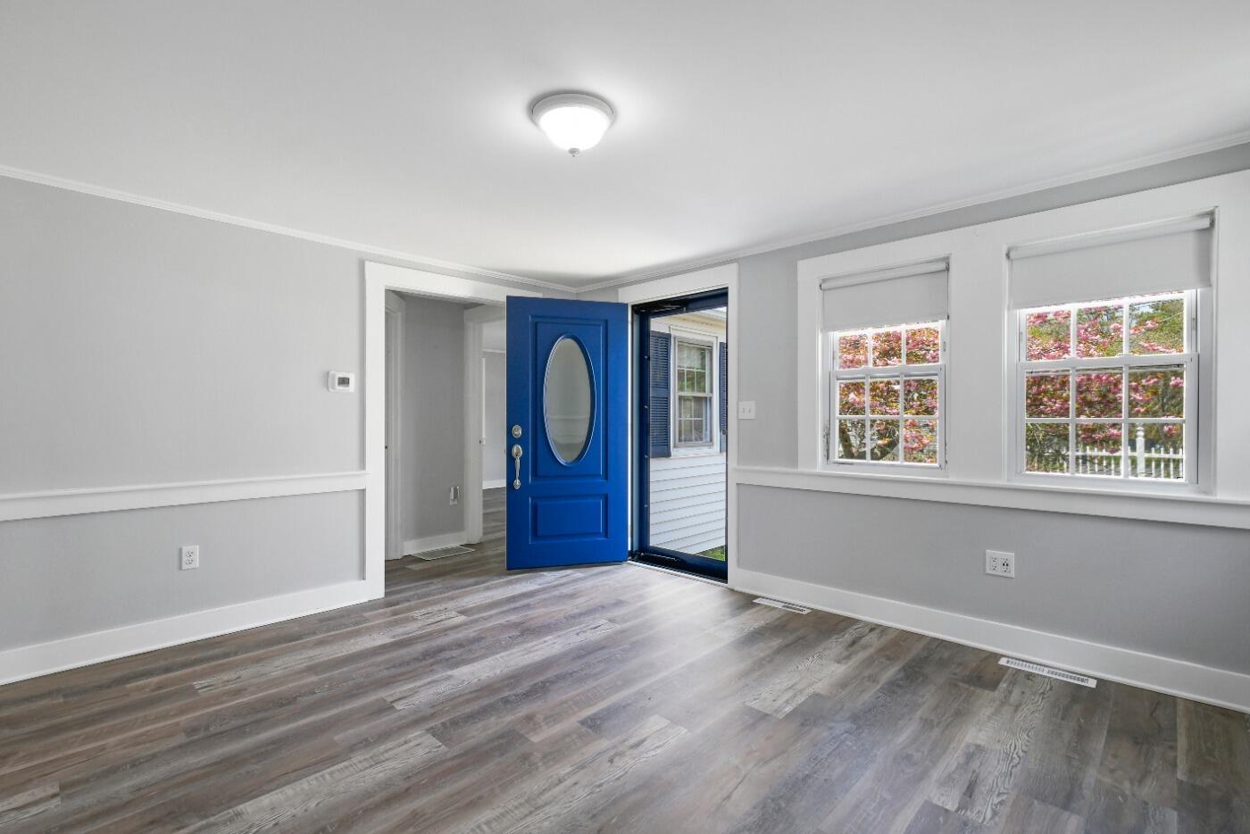 1 Gilbert Road Dennis Port, MA 02639 - Photo 6 of 27 a view of an empty room with wooden floor and a window