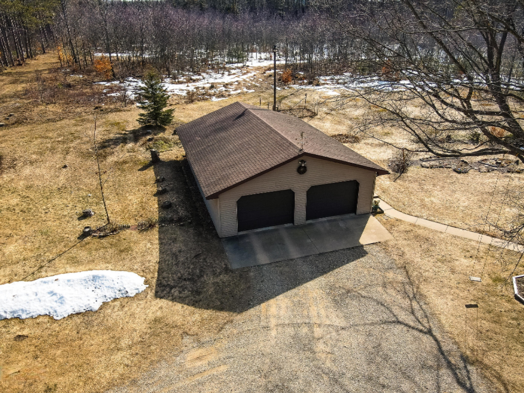 2198 East 24 Road Cadillac, MI 49601 - Photo 25 of 32 garage aerial