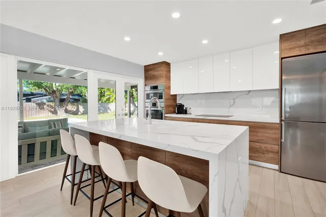 a kitchen with a table and chairs in it