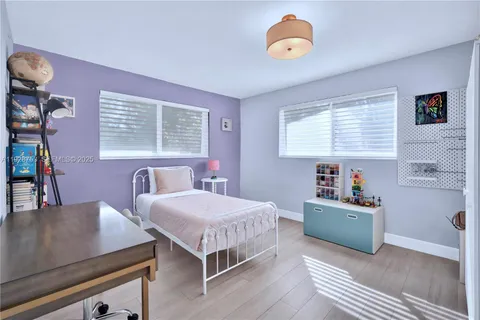 a bedroom with a bed and a table