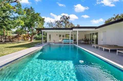 a swimming pool view with a outdoor space