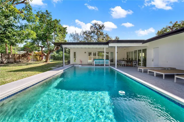 a swimming pool view with a outdoor space