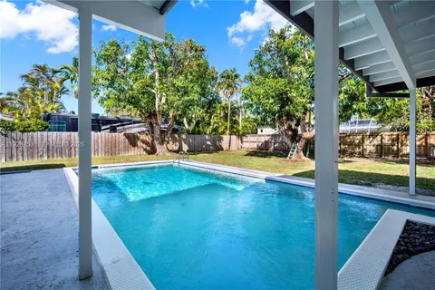 a view of a swimming pool with a patio