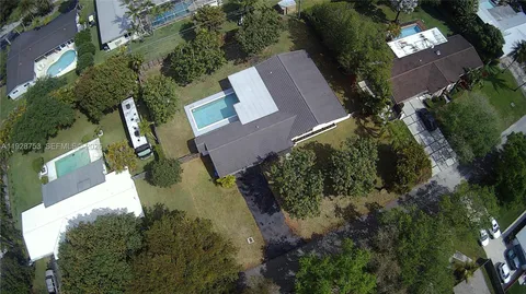 an aerial view of a house with outdoor space