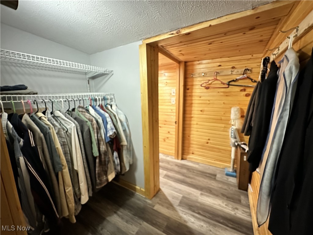 7700 Center Road Ashtabula, OH 44004 - Photo 22 of 31 Walk in closet featuring wood finished floors
