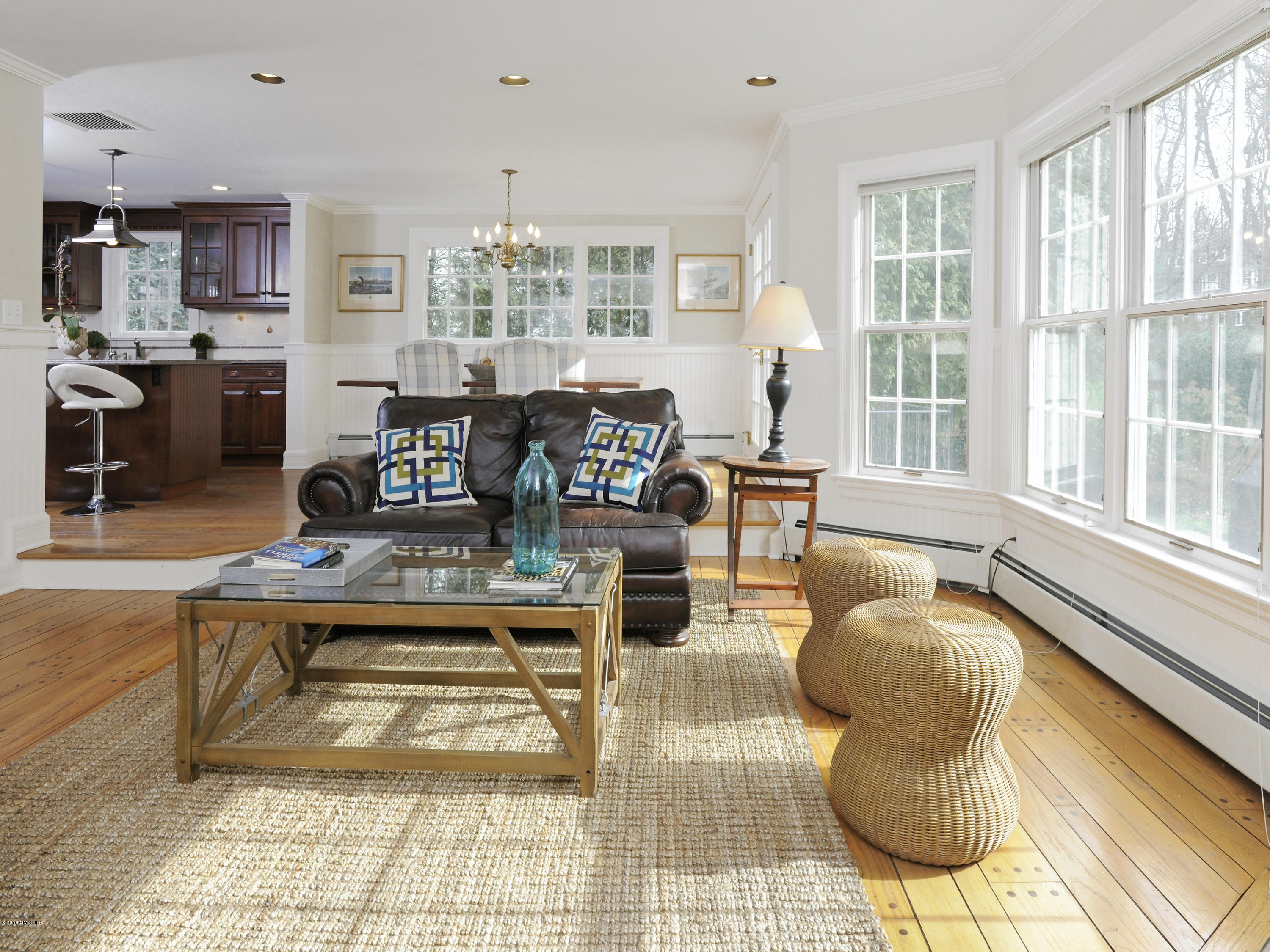 28 Lake Drive Riverside, CT 06878 - Photo 11 of 24 a living room with fireplace furniture and a large window