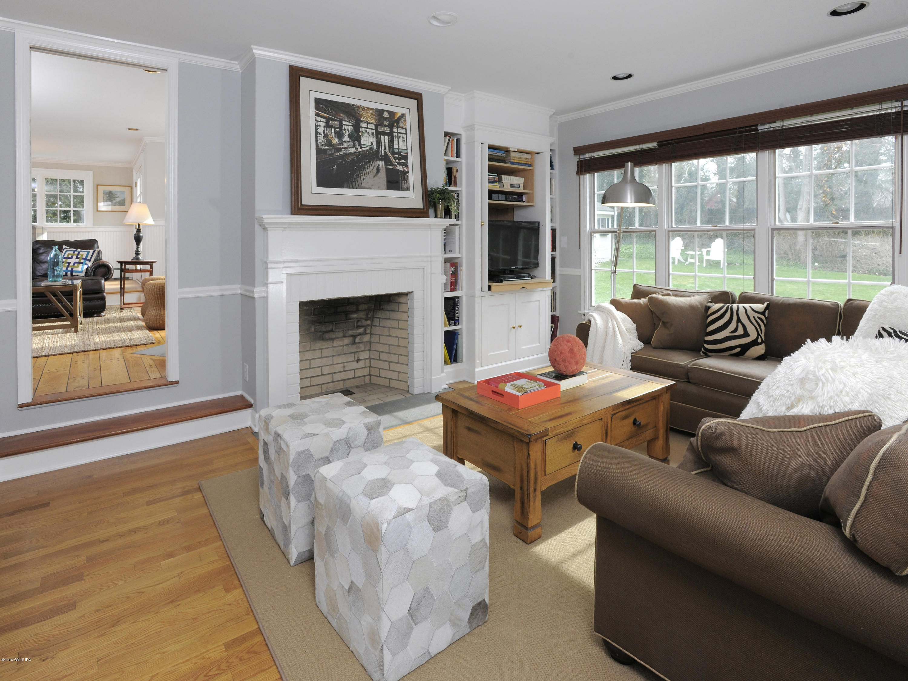 28 Lake Drive Riverside, CT 06878 - Photo 12 of 24 a living room with furniture large window and fireplace