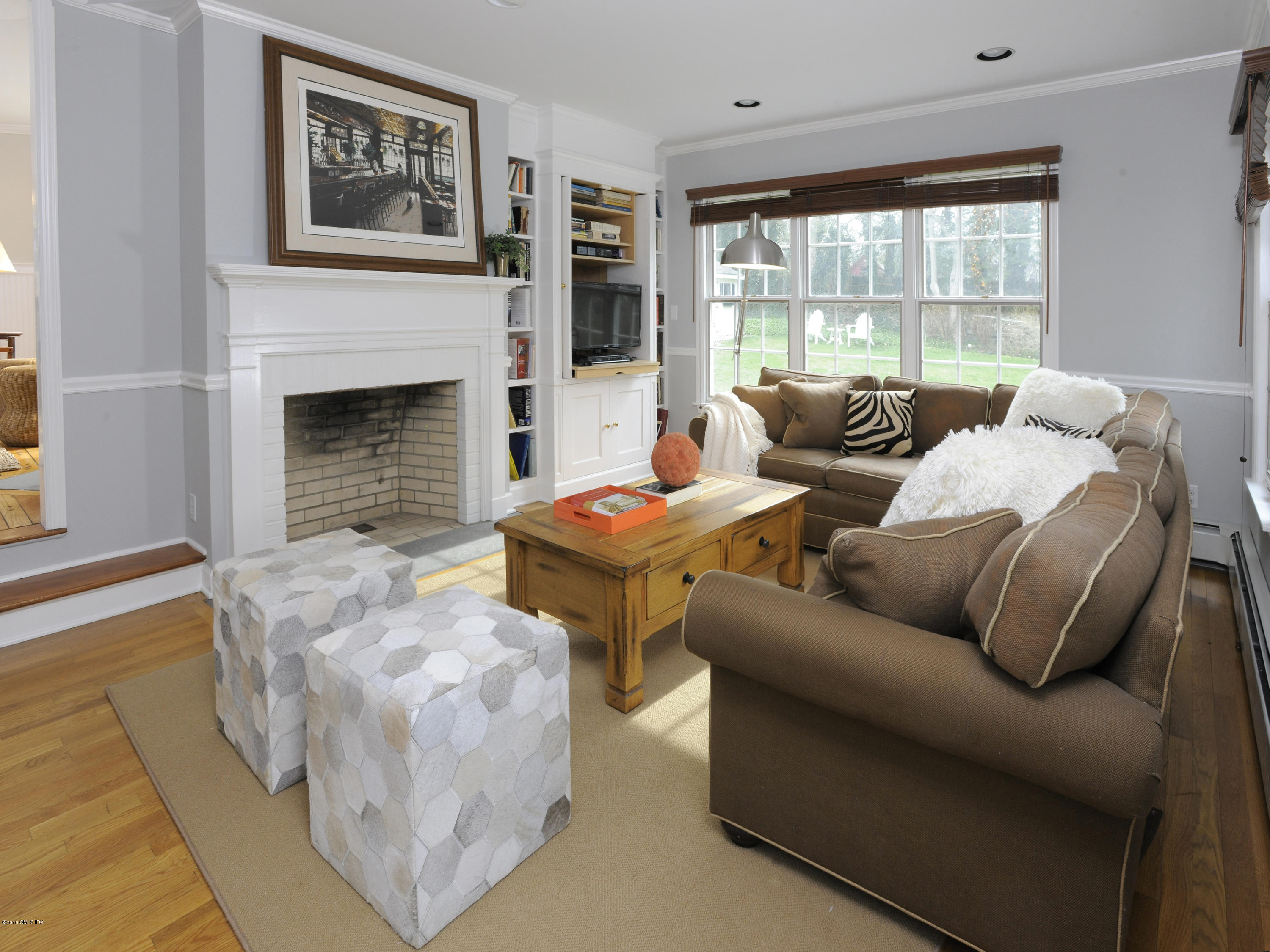 28 Lake Drive Riverside, CT 06878 - Photo 13 of 24 a living room with furniture and a fireplace