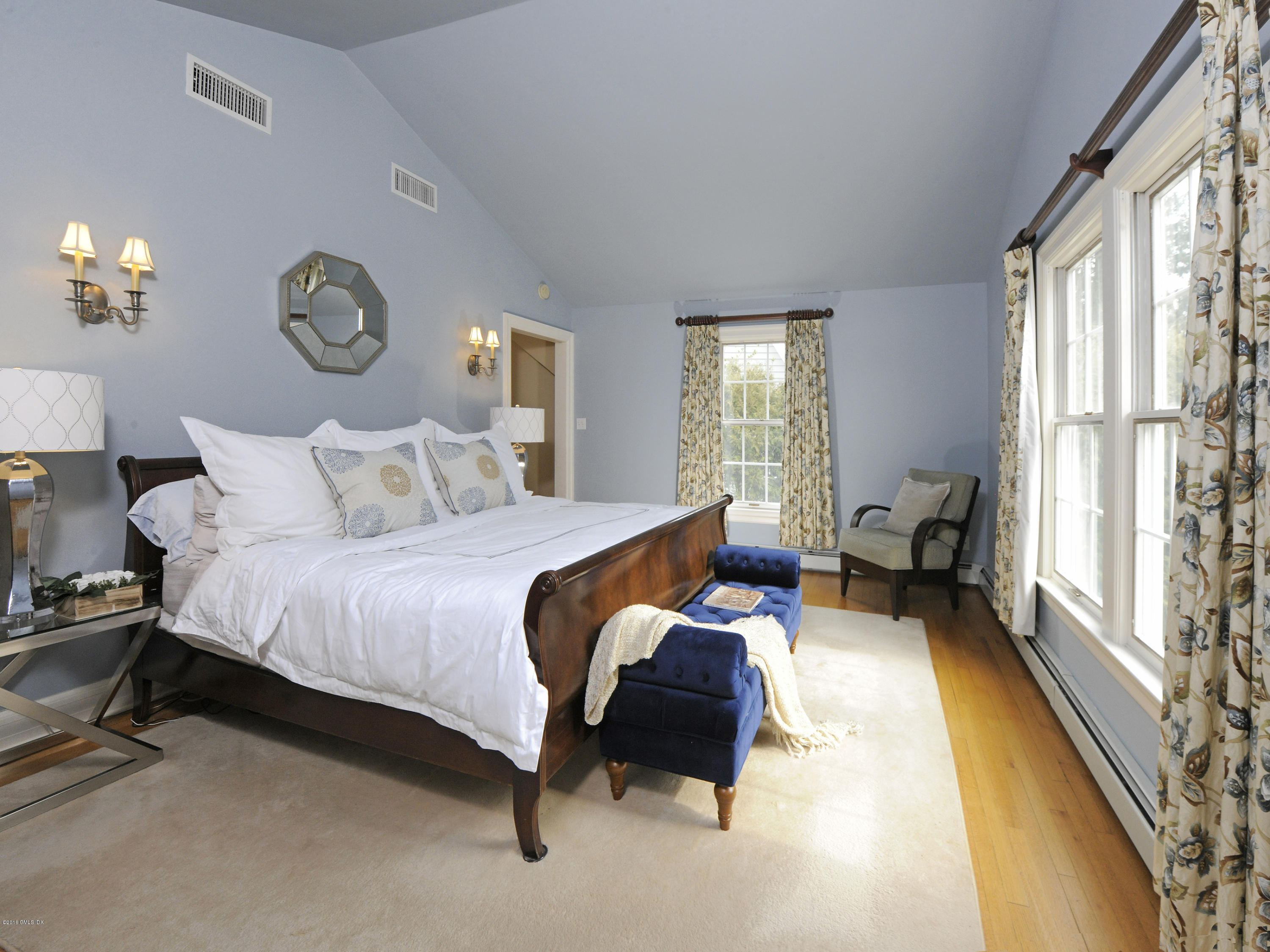 28 Lake Drive Riverside, CT 06878 - Photo 14 of 24 a bedroom with bed and a large window