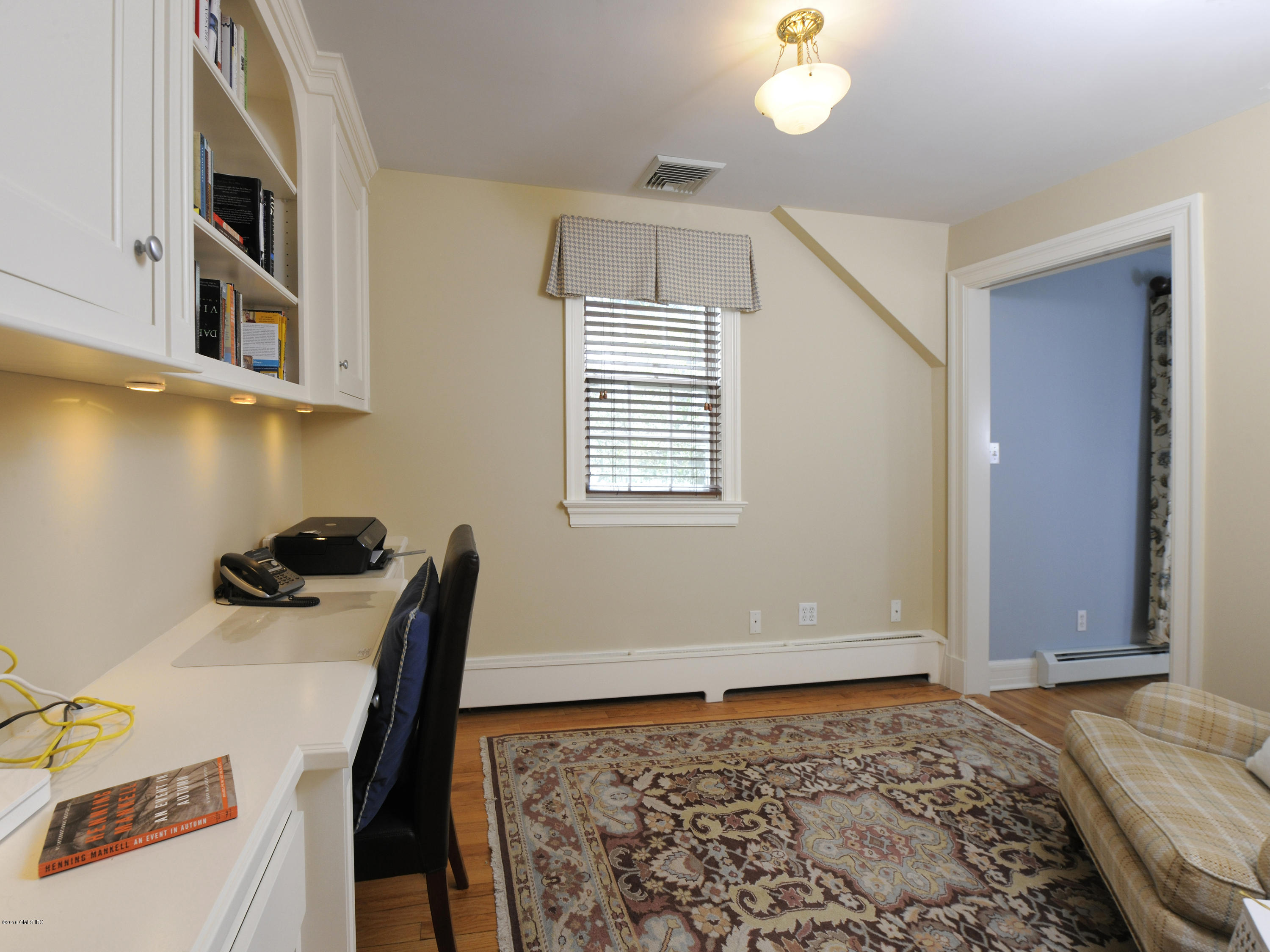 28 Lake Drive Riverside, CT 06878 - Photo 15 of 24 a bedroom with a bed and a window