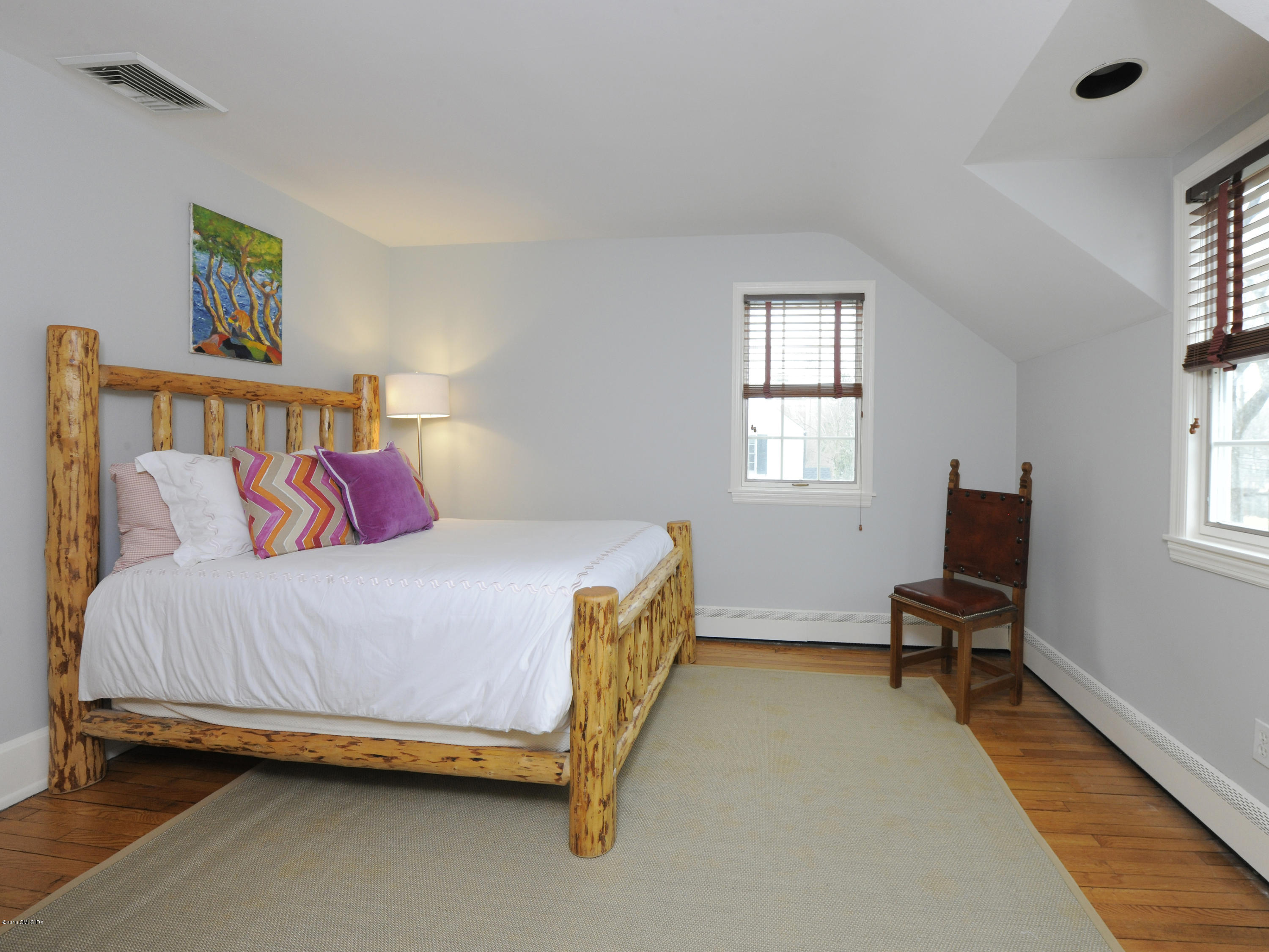 28 Lake Drive Riverside, CT 06878 - Photo 17 of 24 a bedroom with a bed chair and window