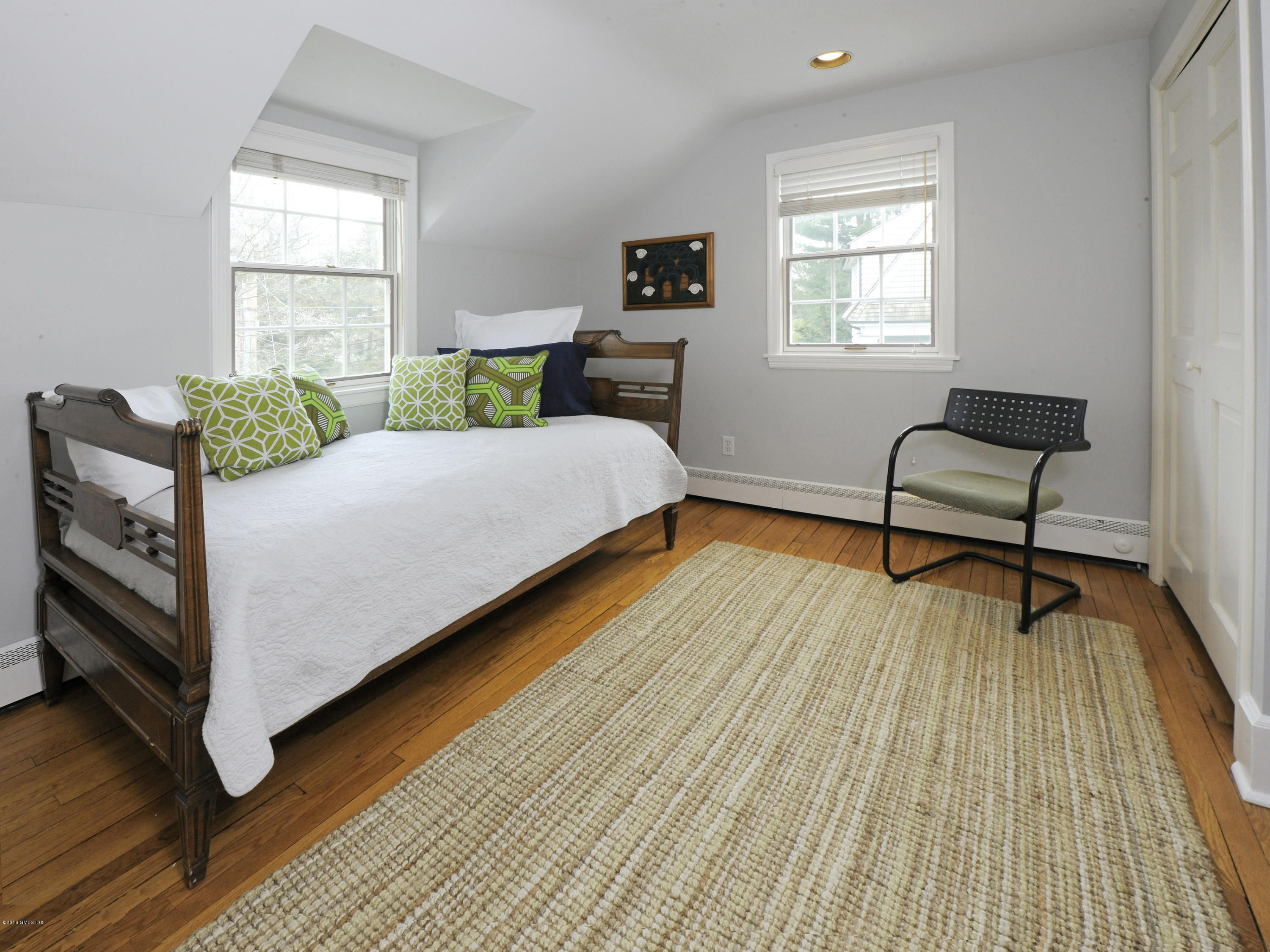28 Lake Drive Riverside, CT 06878 - Photo 18 of 24 a bedroom with a bed and a window
