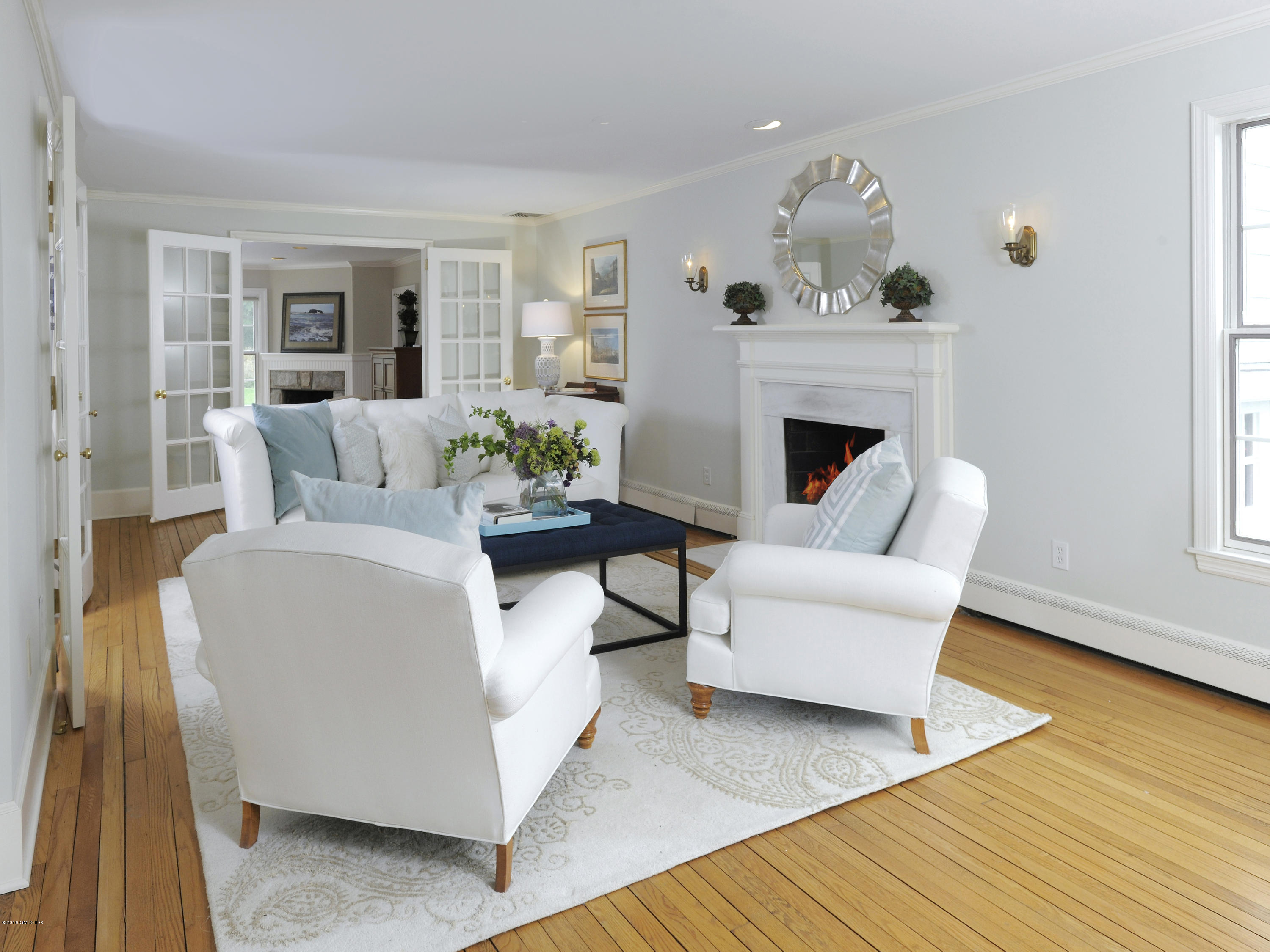 28 Lake Drive Riverside, CT 06878 - Photo 3 of 24 a living room with furniture and a fireplace