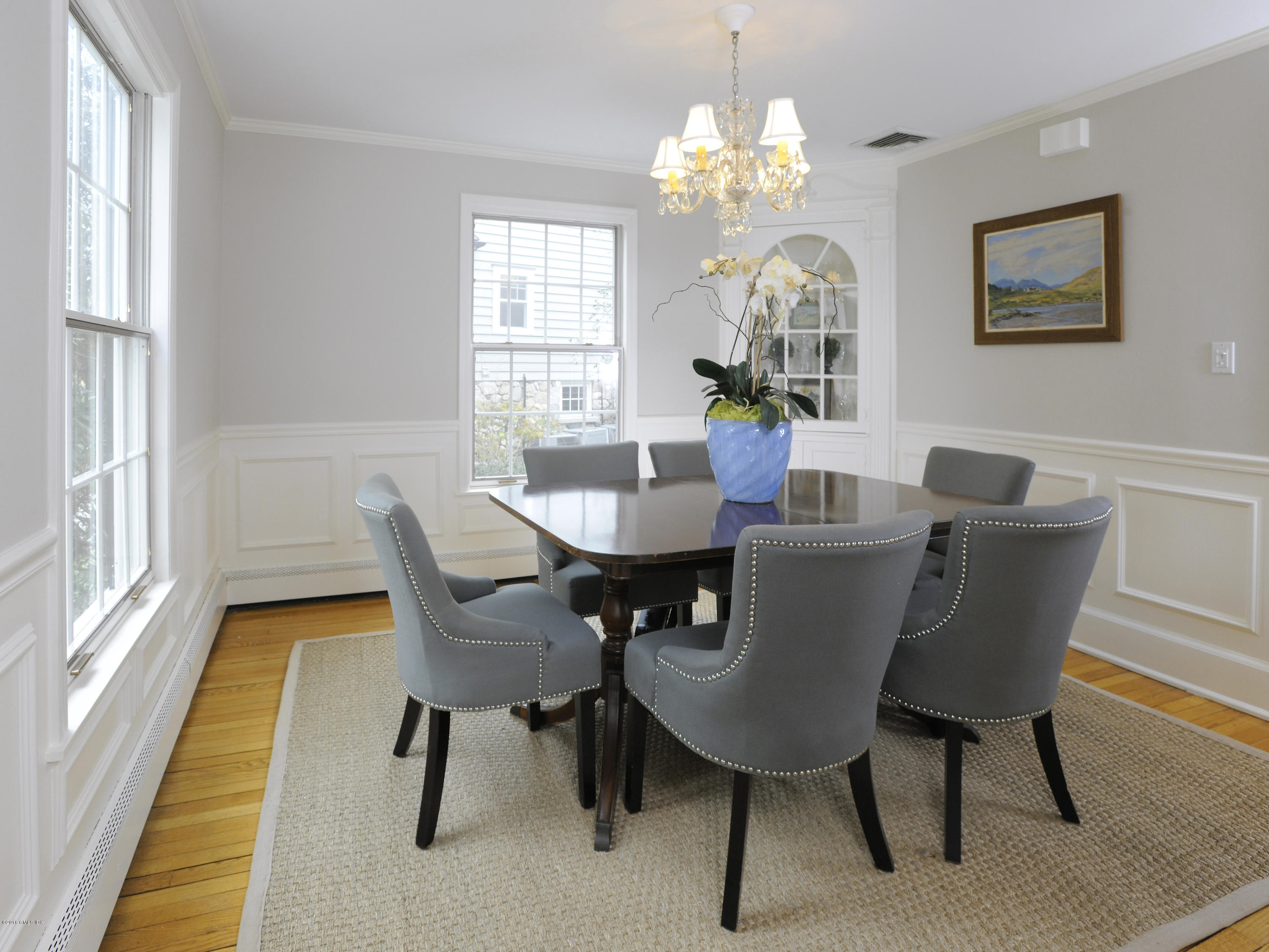 28 Lake Drive Riverside, CT 06878 - Photo 5 of 24 a dining room with furniture a chandelier and wooden floor
