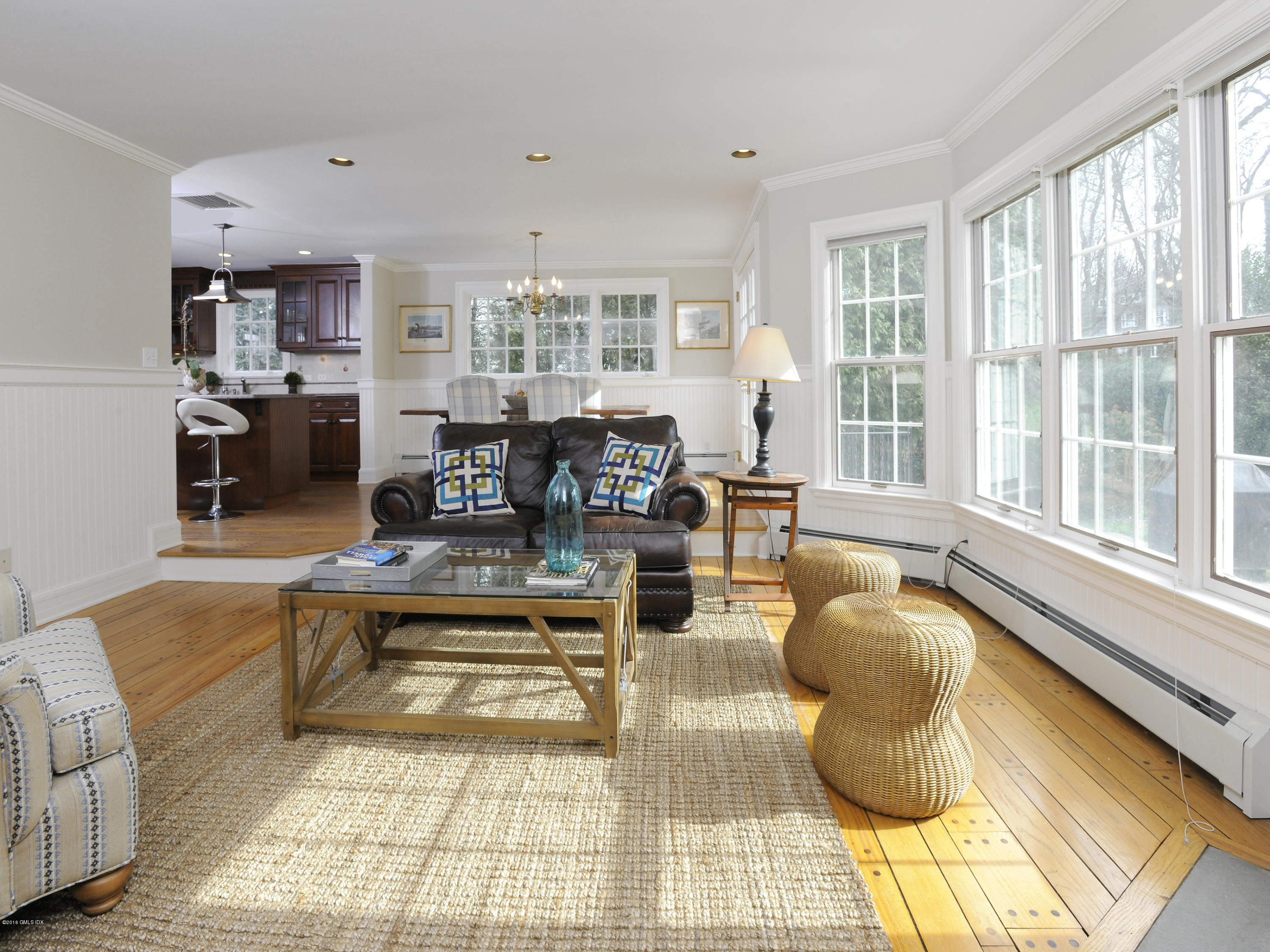 28 Lake Drive Riverside, CT 06878 - Photo 9 of 24 a living room with furniture large windows and wooden floor