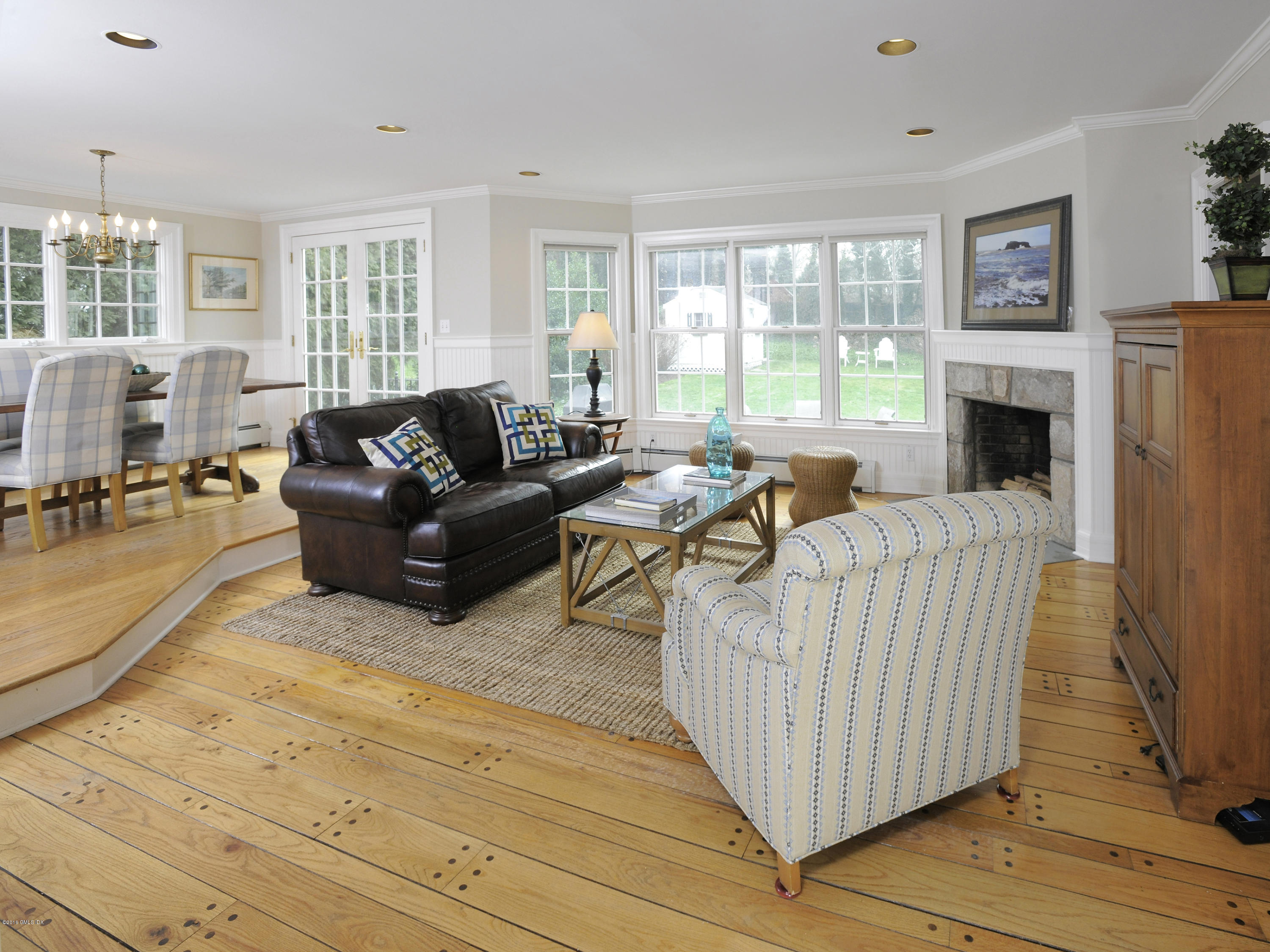28 Lake Drive Riverside, CT 06878 - Photo 10 of 24 a living room with furniture and a fireplace