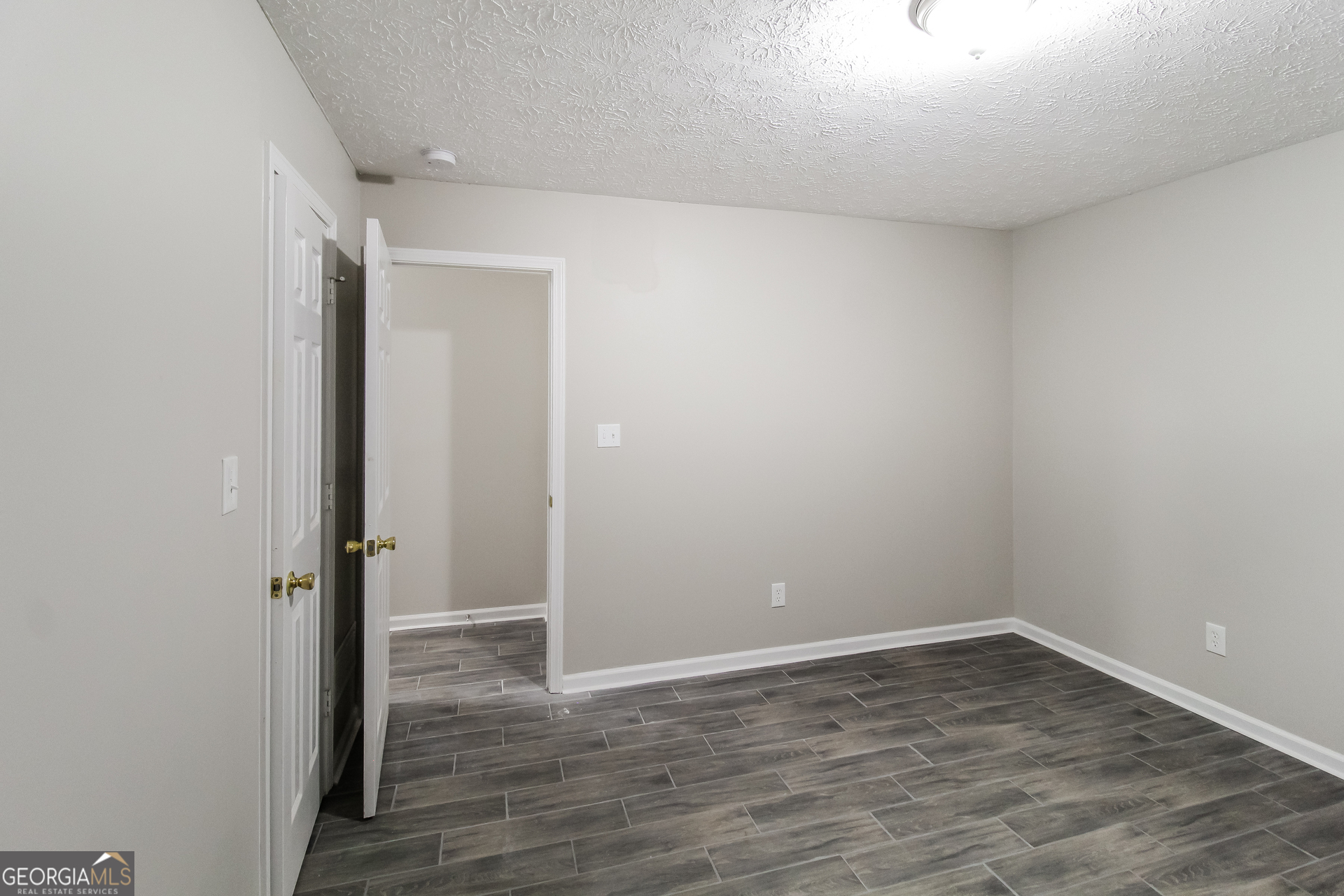 145 Cardell Farms Road Locust Grove, GA 30248 - Photo 12 of 17 wooden floor in an empty room