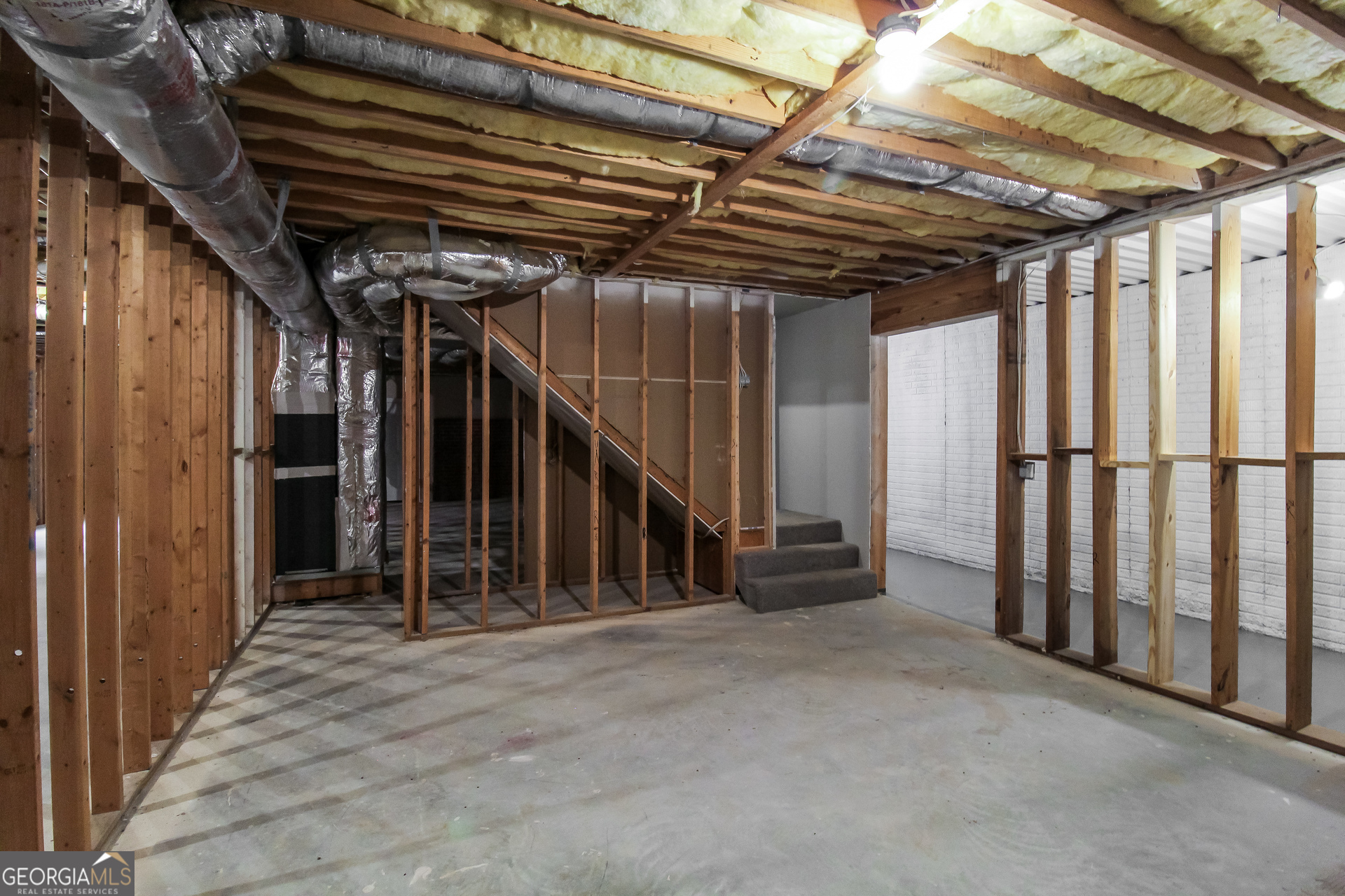 145 Cardell Farms Road Locust Grove, GA 30248 - Photo 14 of 17 a view of an empty room with wooden walls