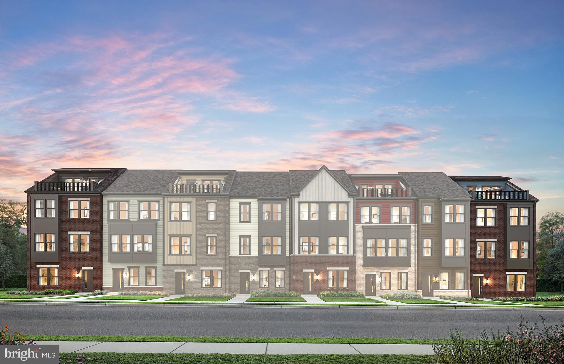 a front view of a residential apartment building with a yard