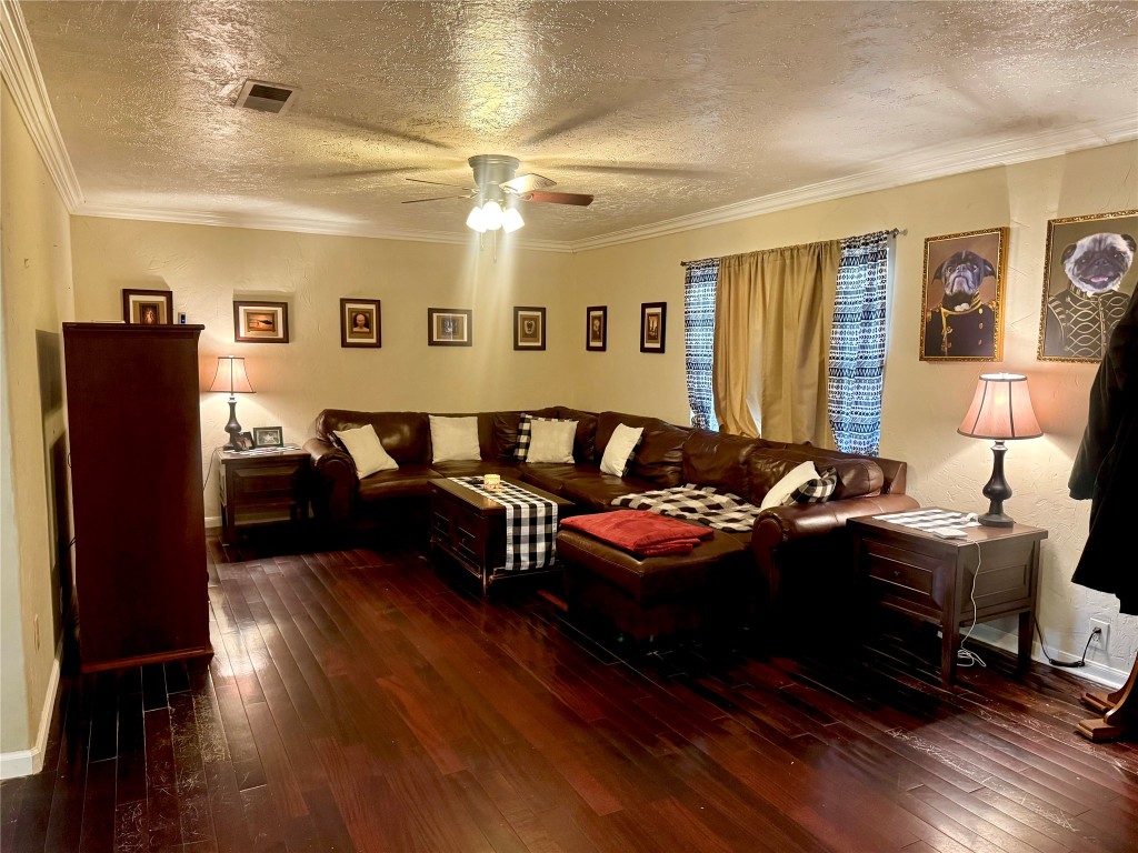 303 Charles Street Cleveland, TX 77327 - Photo 16 of 43 a living room with furniture and wooden floor
