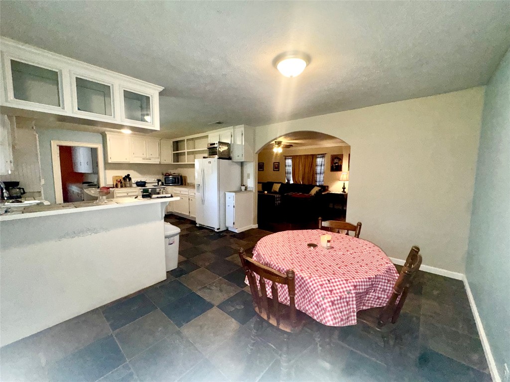 303 Charles Street Cleveland, TX 77327 - Photo 19 of 43 a bed room with furniture and a table