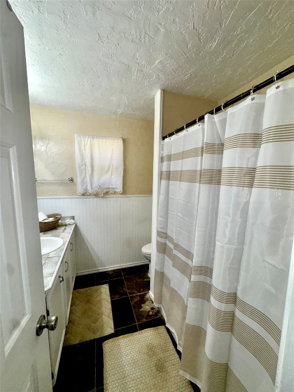 303 Charles Street Cleveland, TX 77327 - Photo 36 of 43 a bathroom with a sink and a mirror