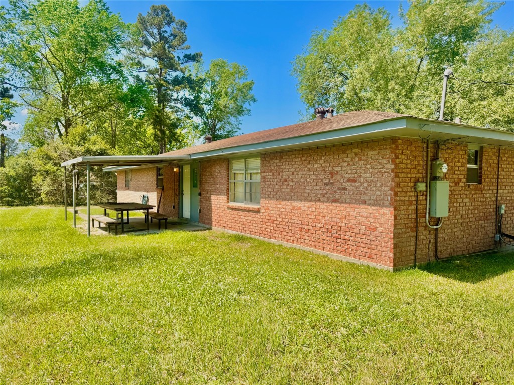 303 Charles Street Cleveland, TX 77327 - Photo 8 of 43 a front view of house with yard