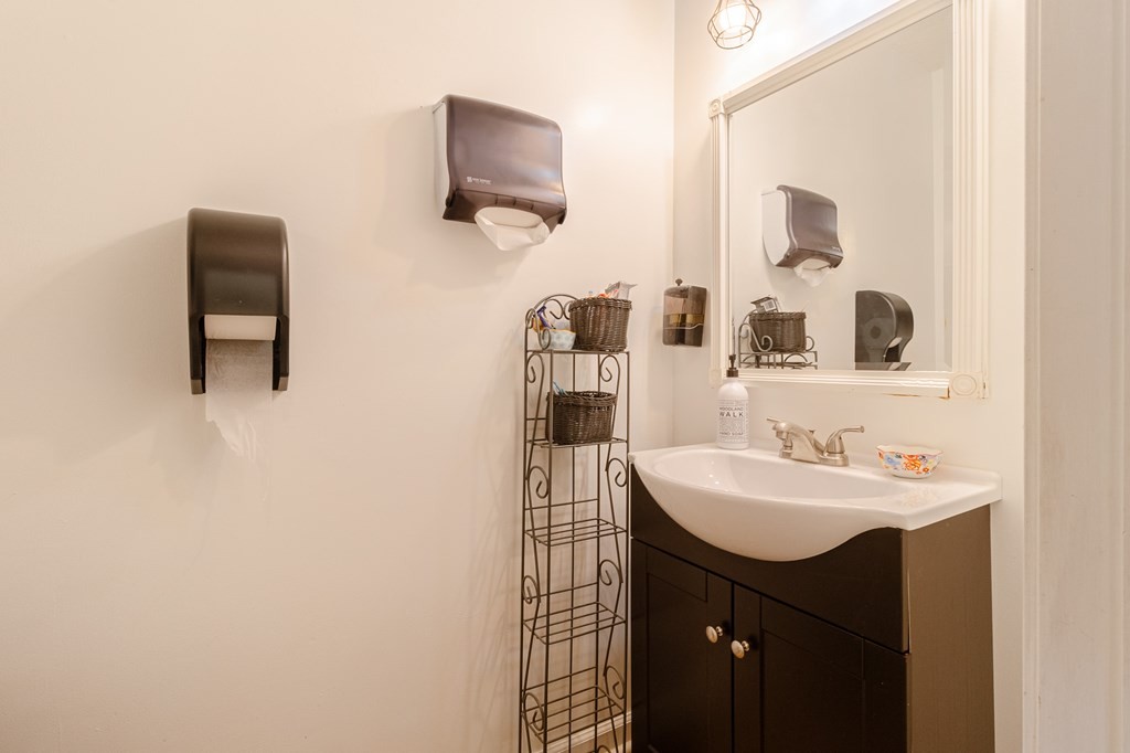 374 Allen Road West Chatsworth, GA 30705 - Photo 18 of 28 a bathroom with a sink and a mirror